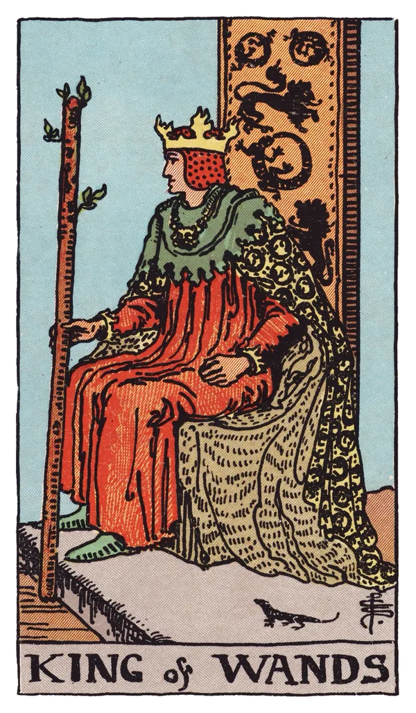 The King of Wands from the Rider-Waite-Smith deck: a king sits sideways on a throne carved with lions and salamanders, wearing a robe patterned with salamanders, holding a budding wand upright, a small salamander visible near the base of his throne, a desert landscape stretching behind him.