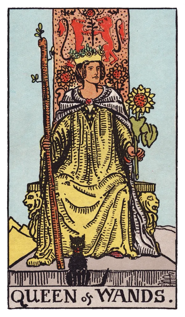 The Queen of Wands from the Rider-Waite-Smith deck: a queen sits facing forward on a throne carved with lions and sunflowers, holding a tall budding wand in one hand and a sunflower in the other, a black cat seated calmly at her feet, sunlight filling the desert scene behind her.