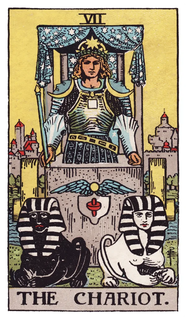 The Chariot from the Rider-Waite-Smith deck: an armored figure stands within an open stone chariot beneath a canopy of stars, crescent moons on each shoulder, holding a wand rather than reins, drawn by two sphinxes — one black, one white — seated at rest before him, with a walled city visible in the background.