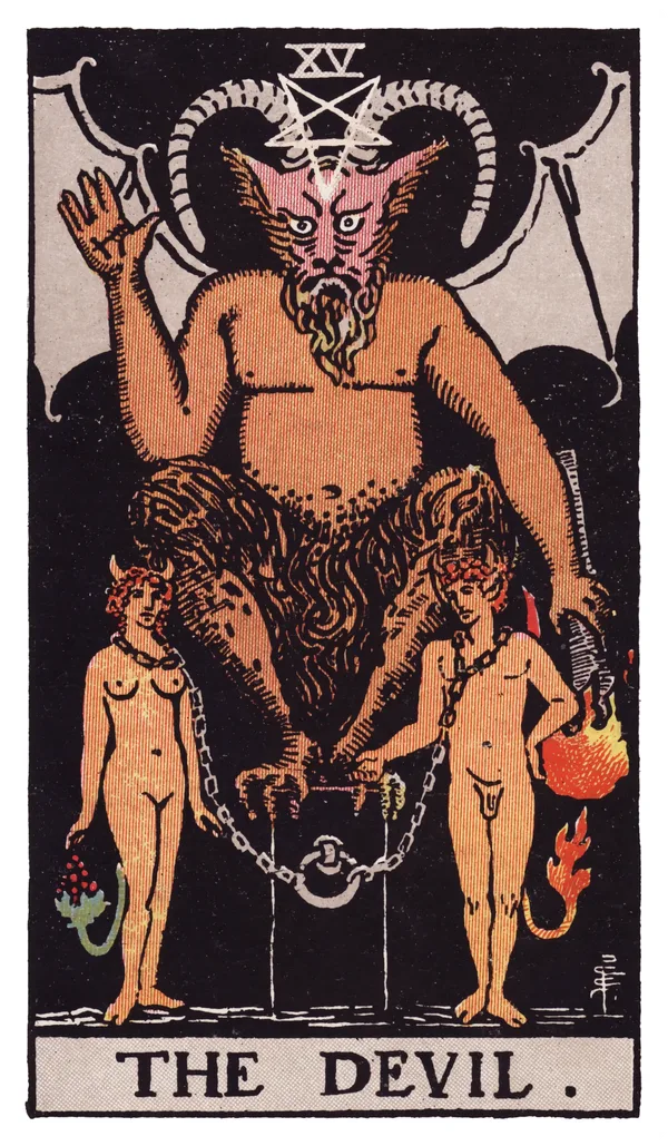The Devil from the Rider-Waite-Smith deck: a horned, half-goat figure with bat wings sits on a black cube pedestal, an inverted pentagram glowing on its forehead, holding a downward-pointing torch, while a naked man and woman stand chained loosely at the pedestal's base, their chains visible but slack enough to remove, small tails — one ending in fire, one in grapes — visible behind them.