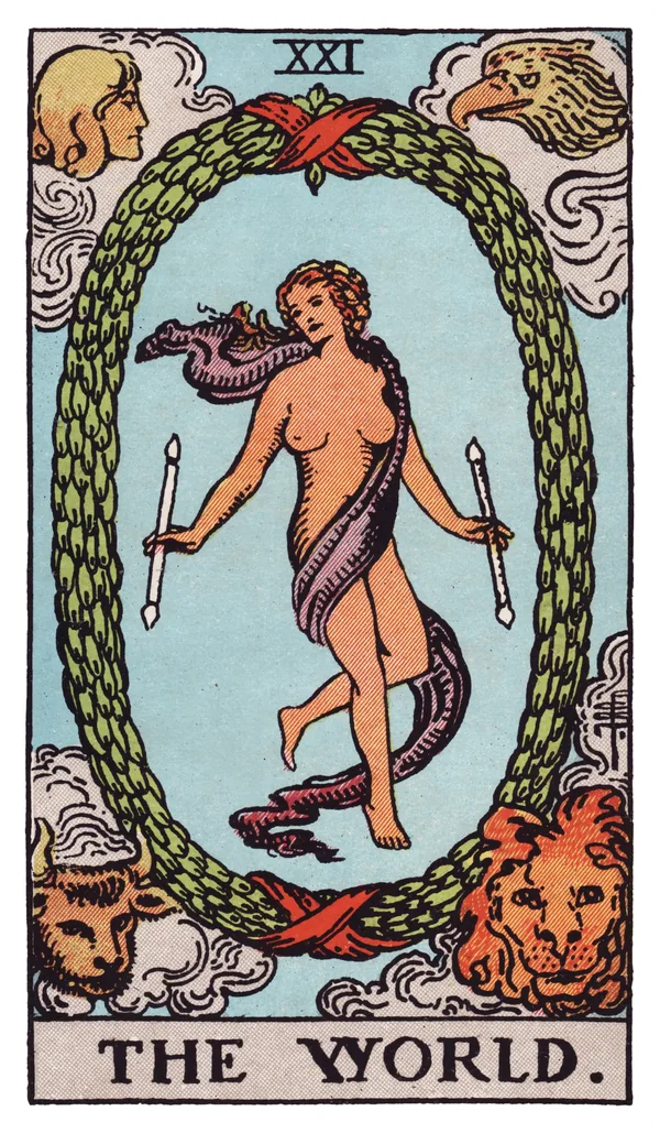 The World from the Rider-Waite-Smith deck: a lightly draped dancing figure holds a wand in each hand at the center of an oval laurel wreath bound top and bottom with red ribbon, her legs crossed at the shin; in the four corners outside the wreath, a winged human figure, an eagle, a bull, and a lion each look inward.